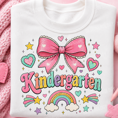 Cute Kindergarten PNG featuring a pink coquette bow, pastel rainbow, hearts, and colorful lettering for back-to-school sublimation projects, t-shirts, tote bags, mugs, and print-on-demand products.